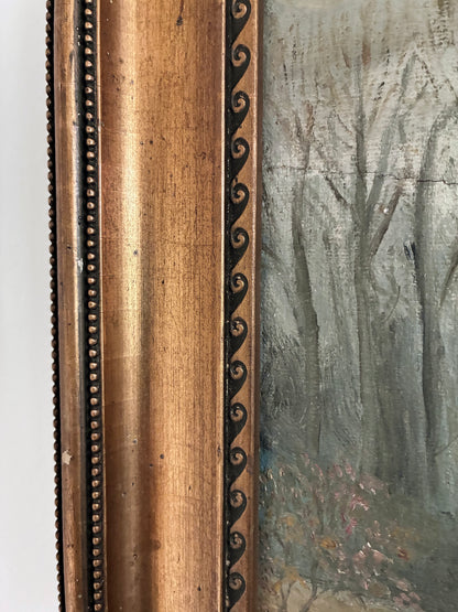Close-up of a antique painting with a detailed wooden gold frame.