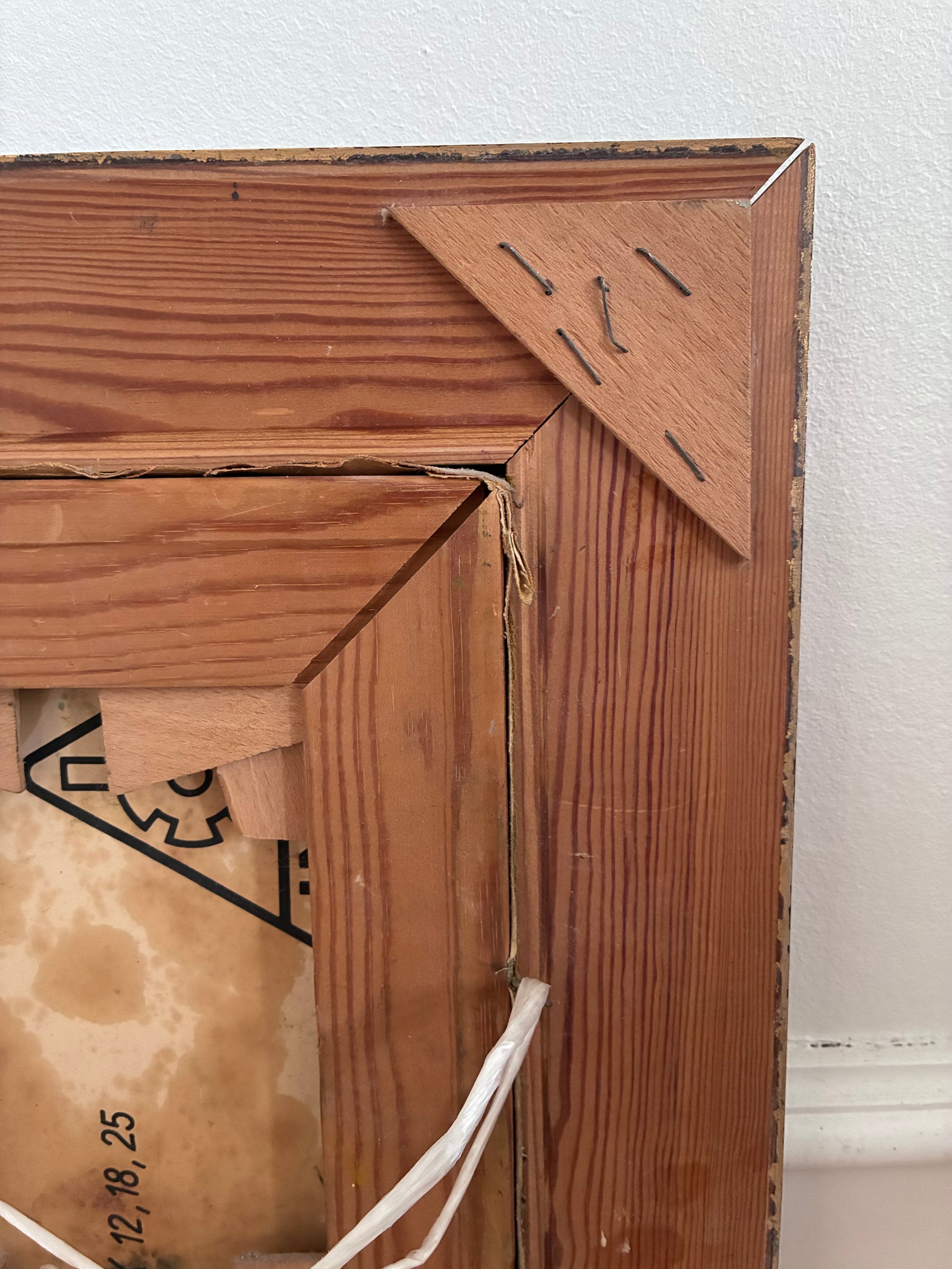 Close-up of a wooden frame with a white background